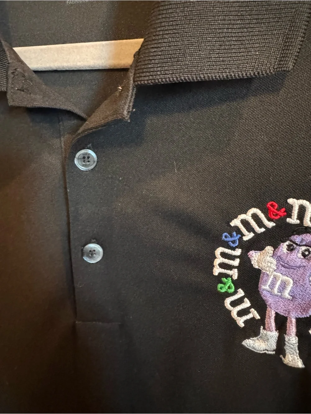 Nike Black Short-Sleeve Polo with Embroidered Purple M&M Character